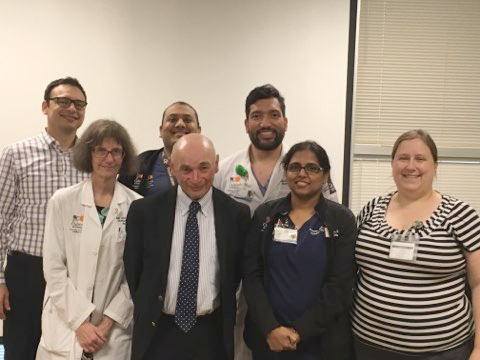 Group of medical faculty and students at a conference.